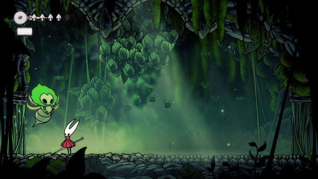 A player fights the Moss Mother boss in Hollow Knight: Silksong